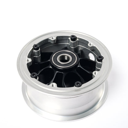 Rear view of CNC electric skateboard hub showing precision machined pulley mounting points and integrated bearing seat