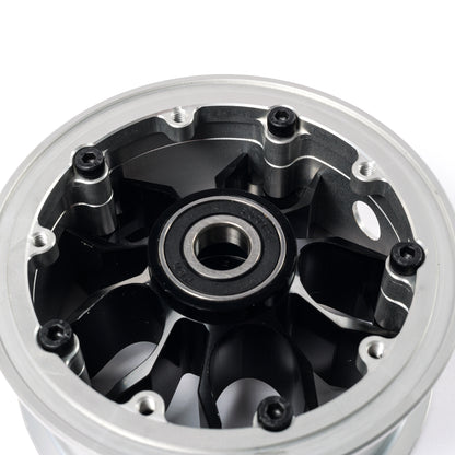 Rear view of CNC electric skateboard hub showing precision machined pulley mounting points and integrated bearing seat