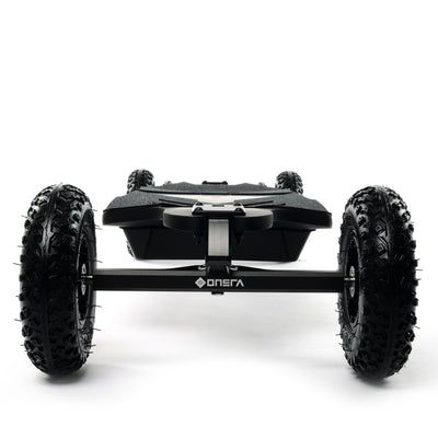 ONSRA BLACK Carve 4 premium electric longboard with a flexible bamboo deck, Gear Drive drivetrain, 14S battery, precision trucks, and all-terrain wheels, shown in a side profile.