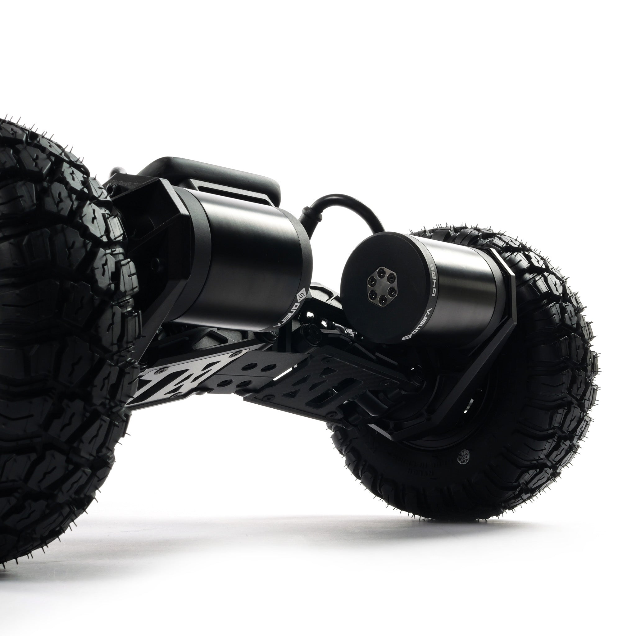 VELAR off-road electric longboard with full suspension, CNC-machined suspension trucks, and large all-terrain tires for a smooth and controlled ride over rough terrain.